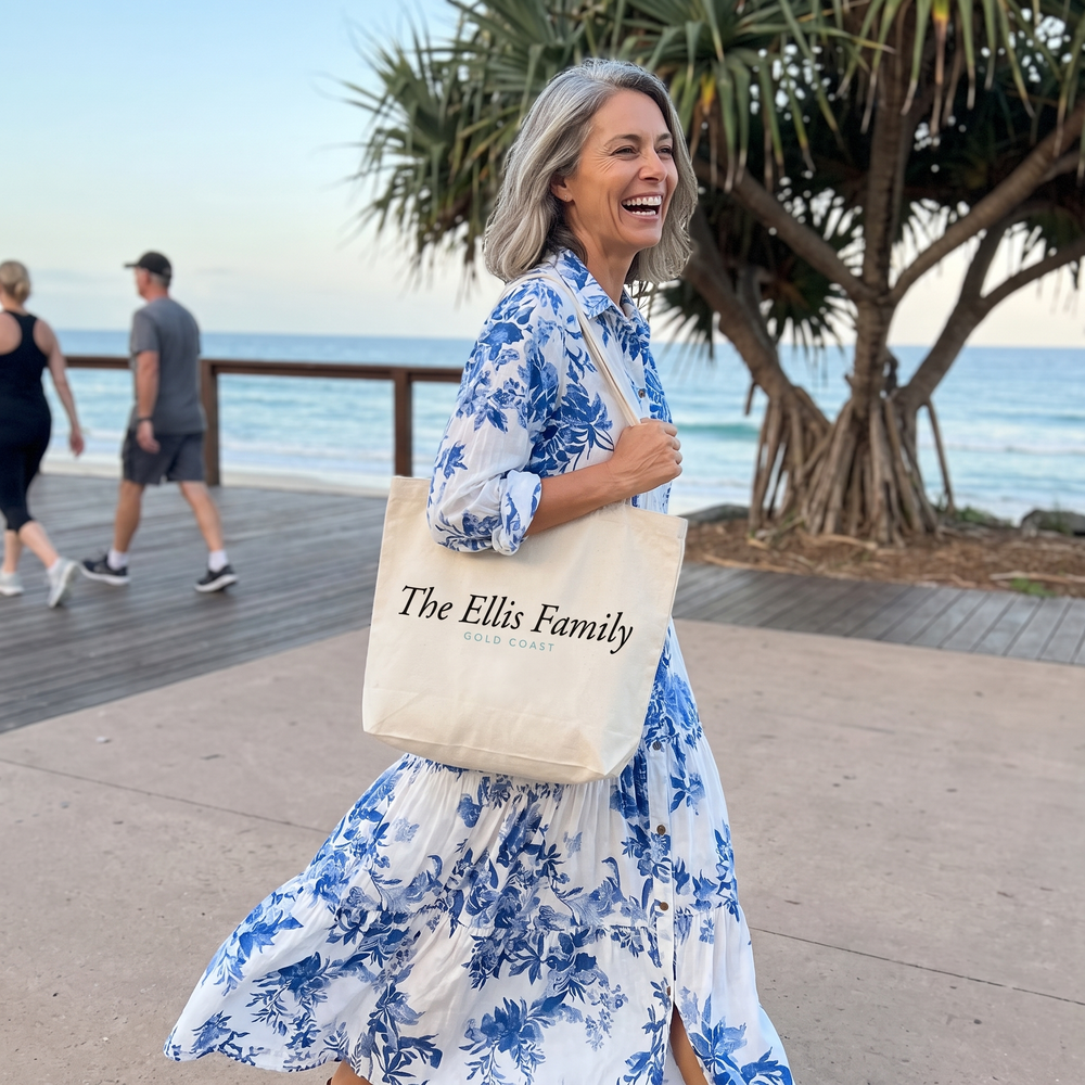 Woman walking the Burleigh Heads boardwalk in a blue floral tiered maxi dress