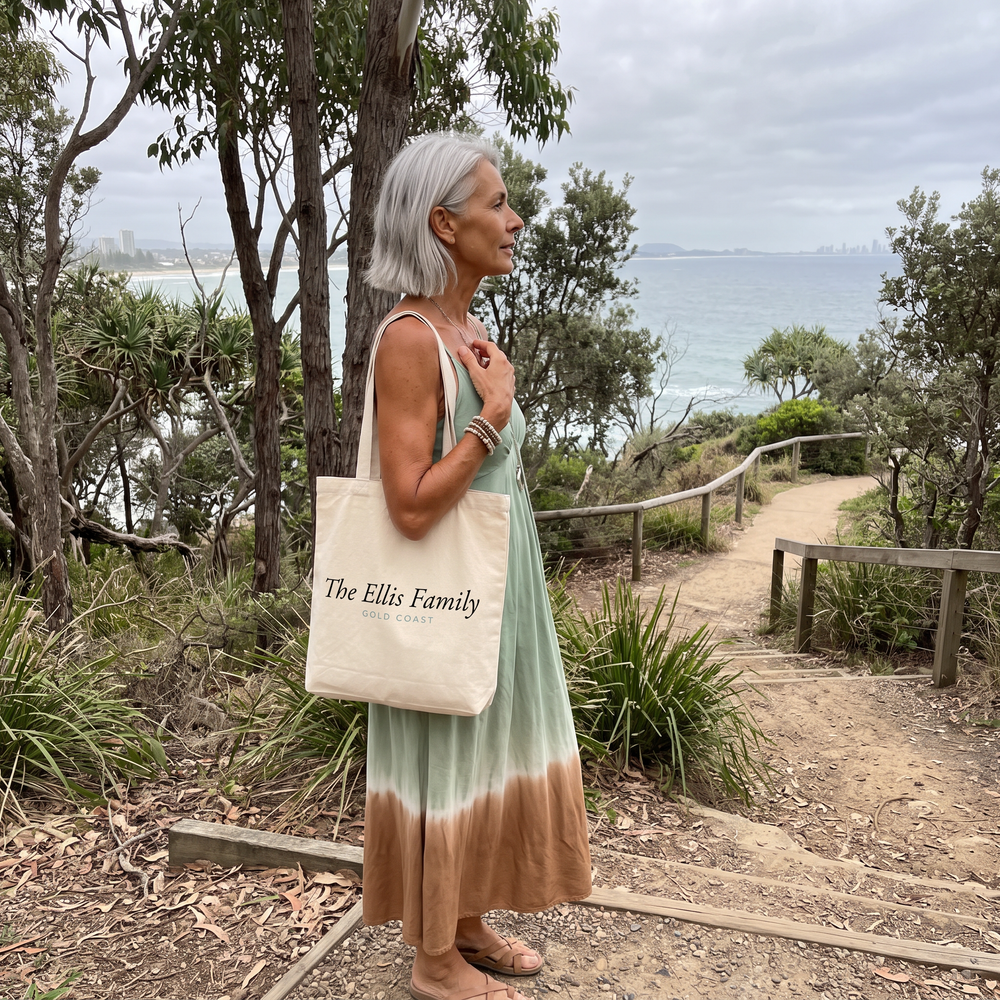 Woman on a coastal walking track in a green and brown soft dye midi dress